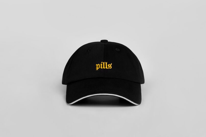 black cap with yellow blackletter embroidery front view
