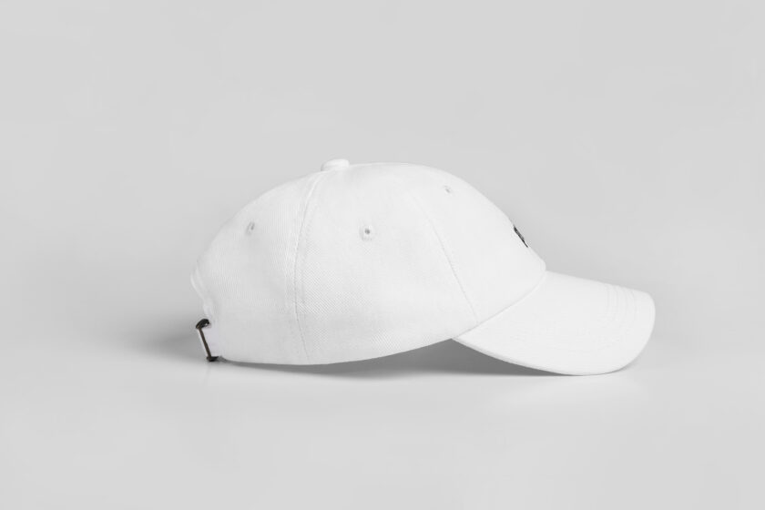 white cap with black blackletter embroidery side view