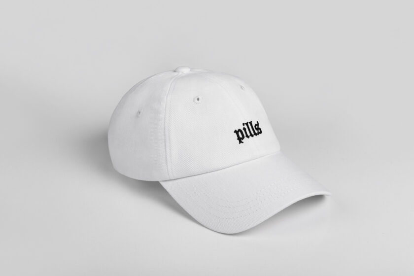 white cap with black blackletter embroidery isometry